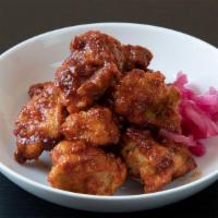 Spicy Gochujang Fried Chicken (Med) · Crispy fried chicken thighs tossed with a sauce of gochujang, garlic, sesame and honey.