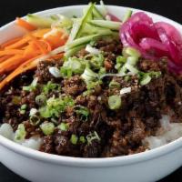 Beef Bulgogi Bowl · Thin sliced ribeye steak marinated with soy, garlic, ginger, onions and black pepper. Served...