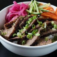 Sesame Beef Brisket Bowl · Slow roasted beef brisket with sea salt, garlic and sesame oil. Served with caramelized cabb...