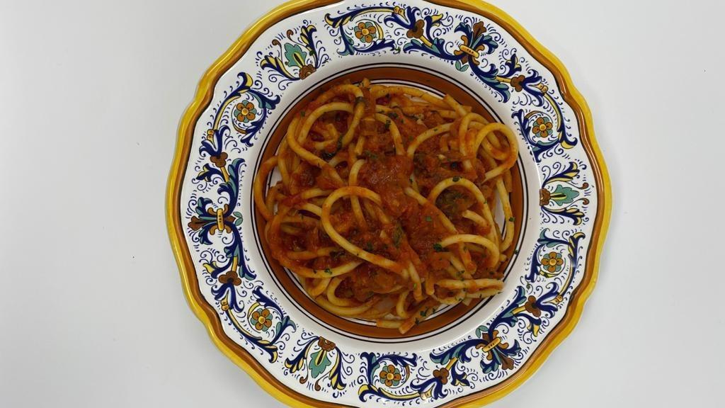 Bucatini All'Amatriciana · Bucatini in amatriciana sauce. Tomato sauce, pancetta and onion.