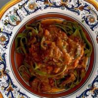 Fettucine Verdi Con Ossobuco Ragu · Homemade spinach fettuccine with veal shank (ossobuco) ragu.