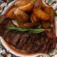 Bistecca E Patate · Grilled skirt steak, thinly sliced and served with roasted potatoes.