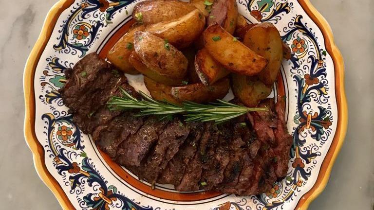 Bistecca E Patate · Grilled skirt steak, thinly sliced and served with roasted potatoes.