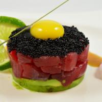 Tuna Tartar · Tuna served with ouail egg and chef special sauce.