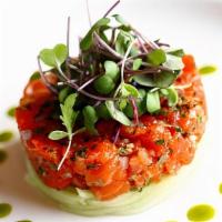 Salmon Tartar · Salmon served with ouail egg and chef special sauce.