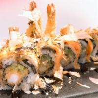 L Ion King Roll · Shrimp tempura ,cheese ,&cucumber inside.  Eel & avocado on top.
w. bonito & eel sauce