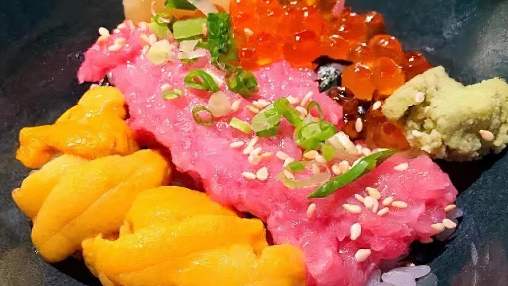 Uni Don · Uni chopped yellowtail & salmon Roe over sushi rice.