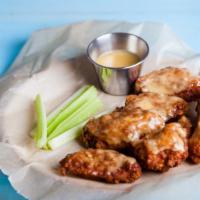 Garlic Parmesan Wings - Bone-In · Classic bone-in wings fried, topped with Garlic Parmesan sauce, cooked to order and perfectl...