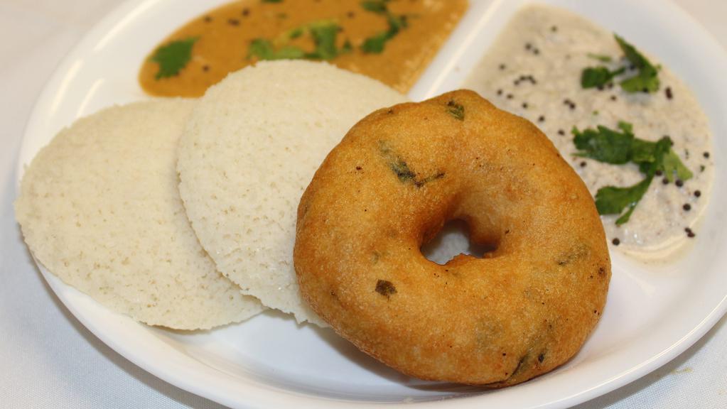 Idly Vada ( 2Pcs Idly , 1 Pc Vada ) · Steamed rice cake and fried lentil donut.