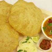 Poori Bhaji · A fully deep fried whole wheat bread served with mild spiced mashed potato.