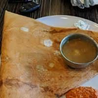 Mysore Masala Dosa · Crepe spread with spicy homemade sauce and filled with mashed potato.