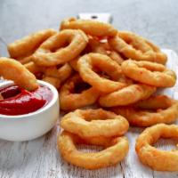 Onion Rings · Hand cut, sweet onions, lightly battered and fried until golden and crispy.