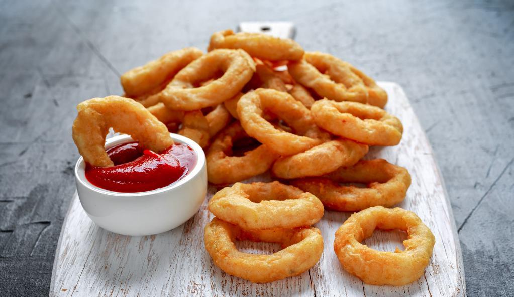 Onion Rings · Hand cut, sweet onions, lightly battered and fried until golden and crispy.