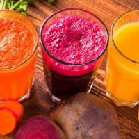 The Super Morning Juice · Fresh wheatgrass, carrots, spinach, cucumbers, and beets.