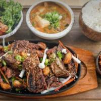 Korean Short Ribs · 24 hour marinated short ribs, grilled and served with accompaniments.