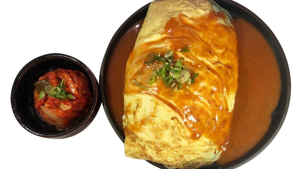 Omurice · Omelette over fried rice (egg, ham, bell peppers, onions, scallion) topped with homemade gravy sauce, contain nuts.