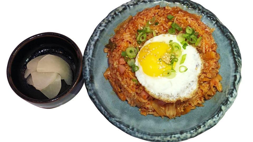 Kimchi Fried Rice · Kimchi (homemade) fried rice with chopped ham, comes with cabbage salad, pickled raddish and fried egg on top.