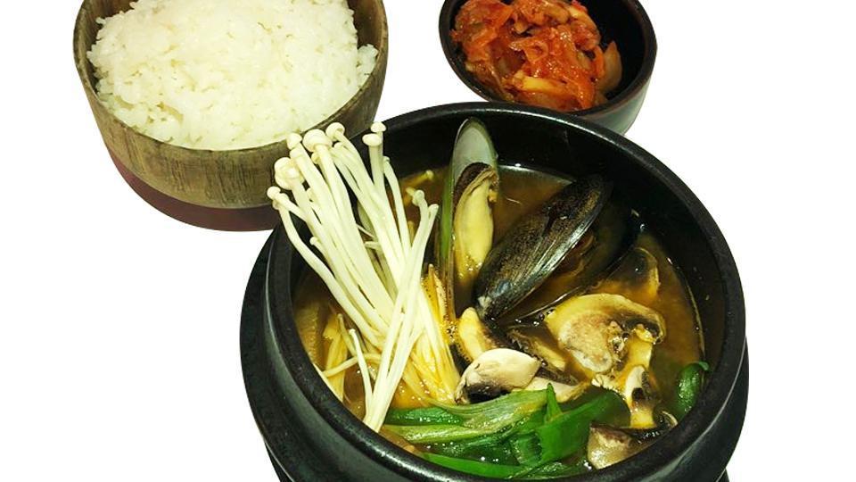 Soybean Stew · Soybean paste soup, (soybean paste, onion, scallion, mushroom, zucchini, potato, radish, pepper) with side of rice and kimchi.