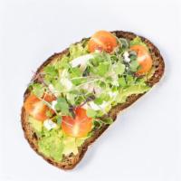Avocado Toast With Poached Egg · Served on a slice of multigrain bread with avocado mash, cherry tomatoes, feta cheese crumbl...