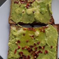 Avocado Toast · Served on multigrain bread with avocado mash, feta cheese crumble, cherry tomatoes, & arugul...
