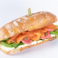 Smoked Salmon · Served on ciabatta hero with smoked salmon, pickled radishes/onions, capers, arugula, & crea...