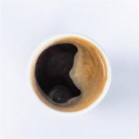 Americano · Two shots of freshly roasted organic espresso served over hot water.