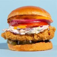 The Fried Chicken Sandwich · Buttermilk fried and served on a brioche bun with tomatoes, pickles, onions, and a chipotle ...
