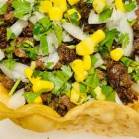Carne Asada Burrito Bowl · Steak Burrito Bowl. Homemade tortilla bowl with rice, beans, onions, cilantro, salsa, and co...