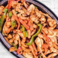 Pollo Salteado · Sautéed chicken strips with sweet onions & mix bell peppers.