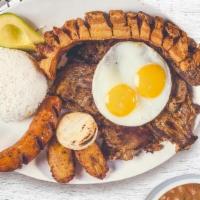 Bandeja Paisa · Typical Colombian dish of steak, pork crackling, chorizo, eggs, rice & beans.
