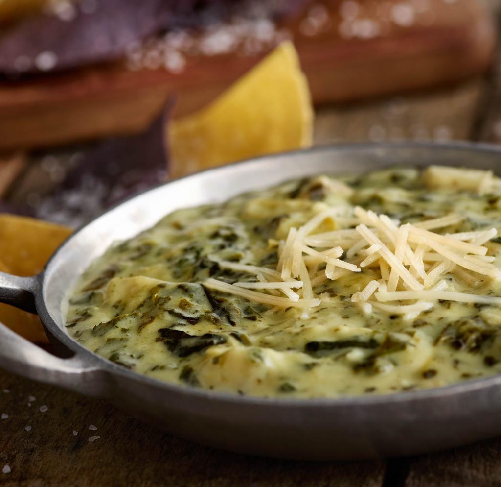 Spinach Artichoke Dip · We recommend these flavorful favorites any day. Made with tender artichoke hearts and shredded Parmesan cheese. Served with unlimited tortilla chips. 900 cal. (Nutrition information only includes one serving of chips).