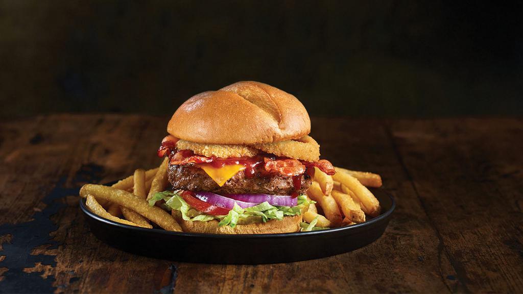 Smokehouse Burger · We recommend these flavorful favorites any day. Cheddar cheese, applewood smoked bacon, barbecue sauce, and crispy onion rings. 1480 cal.