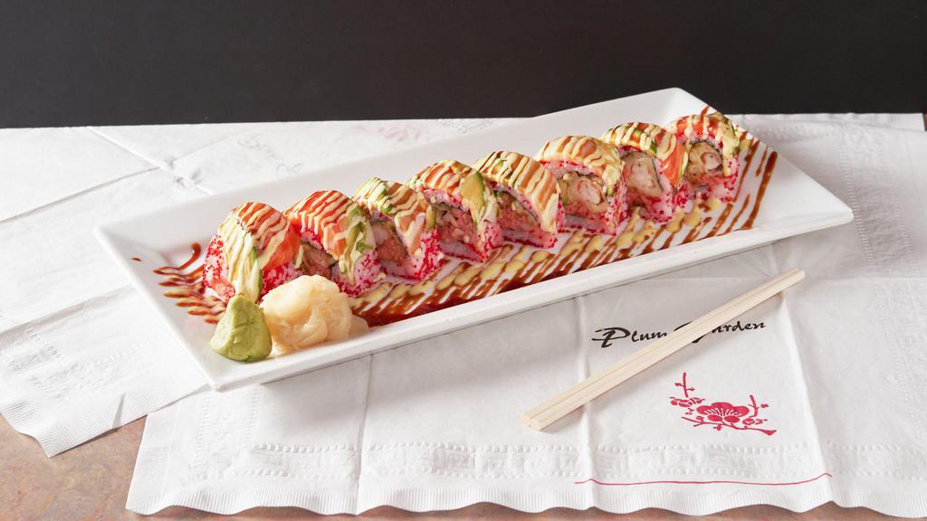 Screaming Roll · Spicy tuna, shrimp tempura, avocado topped with white tuna, salmon, avocado and black tobiko.