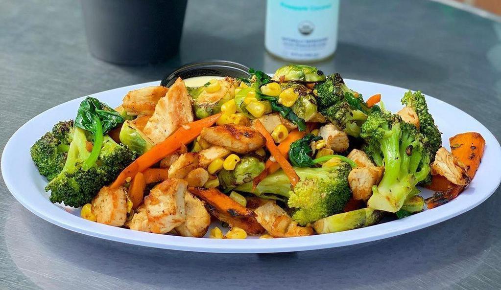 Veggie Chick Bowl · Diced chicken, broccoli, corn, brussel sprouts and carrots drizzled with an agave citrus sauce