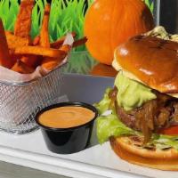 Bison Boy Burger · Lean bison burger, caramelized onions, lettuce, tomatoes, and guacamole with a chipotle sauce