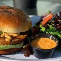 Chipotle Bean Burger · Chipotle Bean patty, romaine lettuce, avocado, and tomatoes on a brioche bun with a side of ...