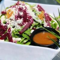 Go Goat! · Arugula, beets, goat cheese, red onions, dried cranberries and walnuts with creamy balsamic ...