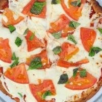 Margherita Pizza · Cauliflower crust, tomato, basil and mozzarella cheese