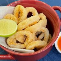 Crispy Calamari · Crispy calamari with plum chili dipping sauce.