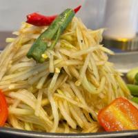 Som Tum Esan · Gluten free, spicy. Papaya salad Thai northeastern style with anchovy sauce, papaya, tomato,...