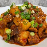 Chicken Cashew · Chicken wok fried in savory sweet chili sauce with vegetables, cashews served with steamed j...