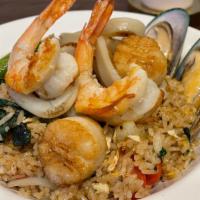 Spicy Seafood Fried Rice · Mixed seafood (scallops, mussels, shrimp, calamari) fried rice in spicy sauce, egg and veget...