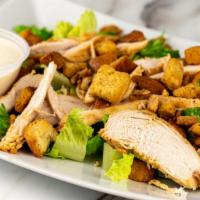 Romaine Caesar Salad · Romaine, croutons, Parmesan cheese and Caesar dressing.