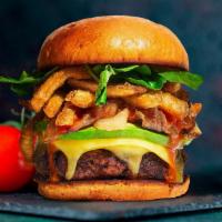 Everything Must Go Vegan Burger · Seasoned Beyond Meat patty perfectly cooked, topped with french fries, avocado, and melted v...