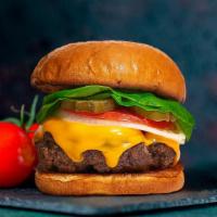 The Cheese Tradition Vegan Burger · Seasoned Beyond Meat patty perfectly cooked, topped with vegan cheddar cheese all on your ch...
