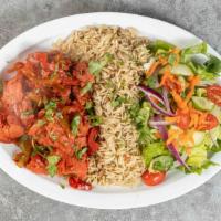 Chicken Tikka With Rice · Marinated chicken sautéed with green peppers and onions, served with rice and salad.