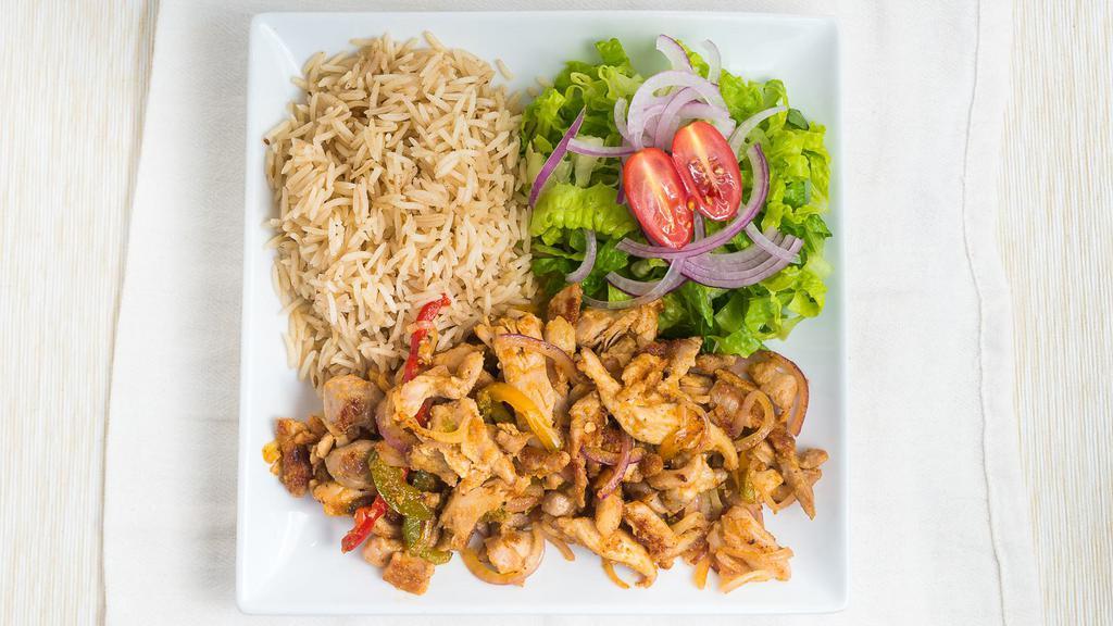Chicken Over Rice · Shredded chicken sautéed with green peppers and onions served with rice and salad.