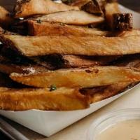 Haus Cut Fries · Hand cut in house, double fried to perfection.  Choice of a house made dipping sauce.  Addit...