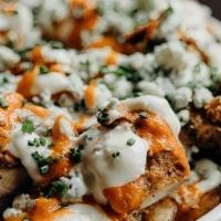 Buffalo Chicken Loaded Fries · Haus cut fries, spicy  buffalo dipped fried chicken, blue cheese sauce, blue cheese crumbles...