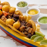 Picada El Cartel · A finger licking contraband served for two. A Colombian favorite consisting of steak,
Colomb...
